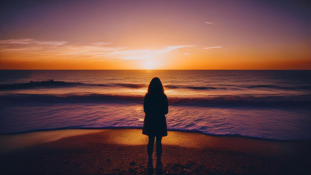 ظل امرأة تقف على الشاطئ